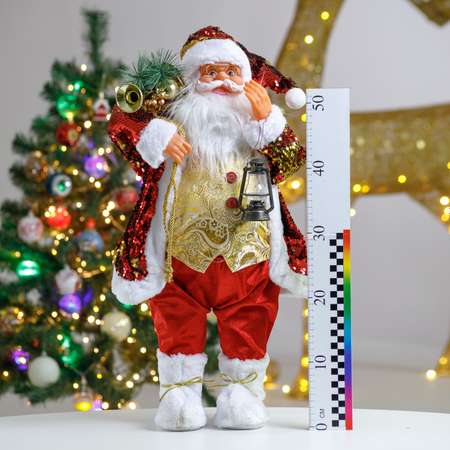 Фигура декоративная BABY STYLE Дед Мороз с пайетками в золотом жилете с фонариком в руке 60 см