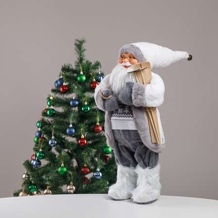 Фигура декоративная BABY STYLE Дед Мороз бело-серый костюм с оленями на свитере с лыжами 60 см
