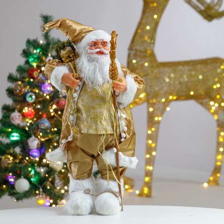 Фигура декоративная BABY STYLE Дед Мороз золотой костюм с посохом и мешком с подарками 60 см