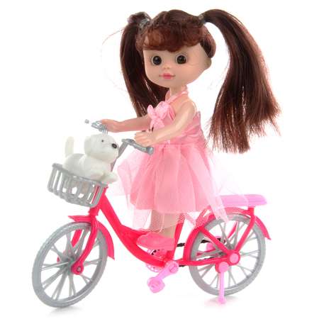 Кукла Veld Co На велосипеде