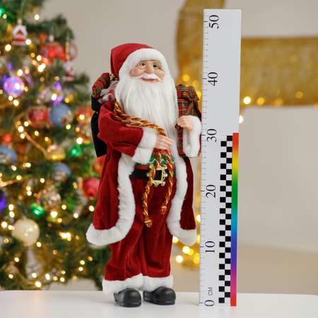 Фигура декоративная BABY STYLE Игрушка Дед Мороз в бордовой длинной шубе с белым орнаментом с подарками 45 см