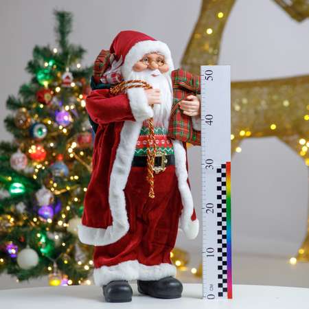 Фигура декоративная BABY STYLE Дед Мороз в бордовой длинной шубе с белым орнаментом с подарками 60 см