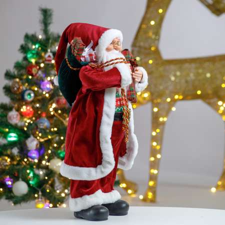Фигура декоративная BABY STYLE Дед Мороз в бордовой длинной шубе с белым орнаментом с подарками 60 см