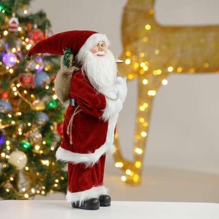 Фигура декоративная BABY STYLE Игрушка Дед Мороз в бордовом костюме с белым орнаментом с мешком с подарками 45 см