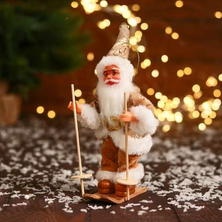 Дед мороз Зимнее волшебство «В блестящем костюмчике на лыжах» 16 см золотисто-белый