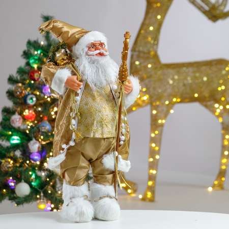 Фигура декоративная BABY STYLE Дед Мороз золотой костюм с посохом и мешком с подарками 60 см