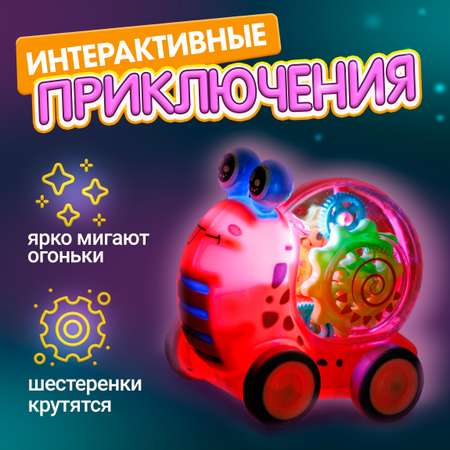 Машинка прозрачная с шестеренками 1TOY светящаяся интерактивная для малышей розовая