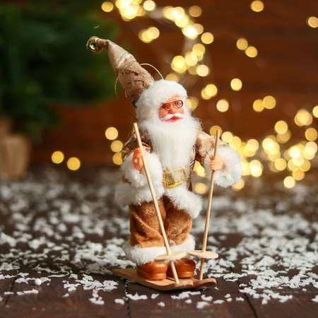 Дед мороз Зимнее волшебство «В блестящем костюмчике на лыжах» 16 см золотисто-белый